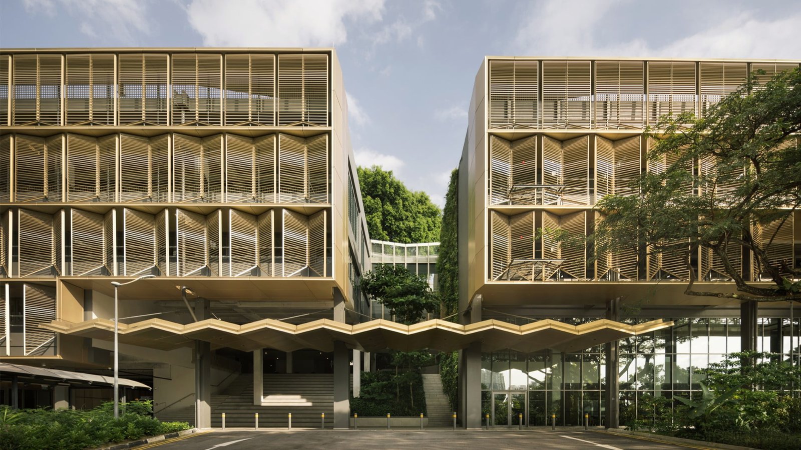 NUS's innovative wooden and glass structure, designed as the first building cluster aiming for net-zero energy consumption.